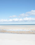 Capturing the quiet beauty of the Cape at low tide, where shallow water reflects the sky and creates a seamless blend.