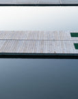 Wooden dock extending into a calm body of water