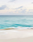 This image displays a framed artwork titled "Harbour Island," featuring a serene beach scene from the Bahamas. The print captures the essence of a tranquil beach, highlighted by the gentle Lap of turquoise waters against the soft, sandy shore.