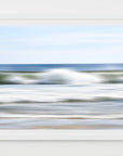 Framed abstract image of a beach scene with ocean waves, blurred blue white and green lines
