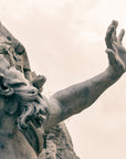 A moody sepia toned image of a statue in piazza Navona, Rome