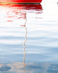Red boat reflecting in thew water