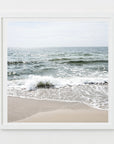 This image presents an artwork titled "Shore Thing," featuring a serene beach scene with the calming waves of the ocean meeting the sandy shore. The photograph highlights the natural beauty of Harwich Port on Cape Cod.