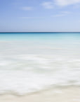 A surreal soft ocean scape abstract with burred clear waters and a turquoise blue horizon