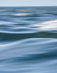 This image displays an abstract representation of the Nantucket Sound. The artwork captures the fluid, ever-changing nature of water with its smooth, flowing textures in shades of blue.