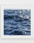 This image features a captivating photograph titled "Deep Waters," showcasing the serene and expansive Nantucket Sound. The composition captures the calming effect of the ocean waves, highlighted by the gentle sparkle of sunlight reflecting off the water's surface.