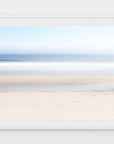 This image presents a fine art photograph titled "Keep Going," featuring a serene beach scene in Orleans, Cape Cod. The artwork captures a minimalist landscape, showcasing the subtle textures of the beach sand and the gentle gradient of the ocean meeting the sky.