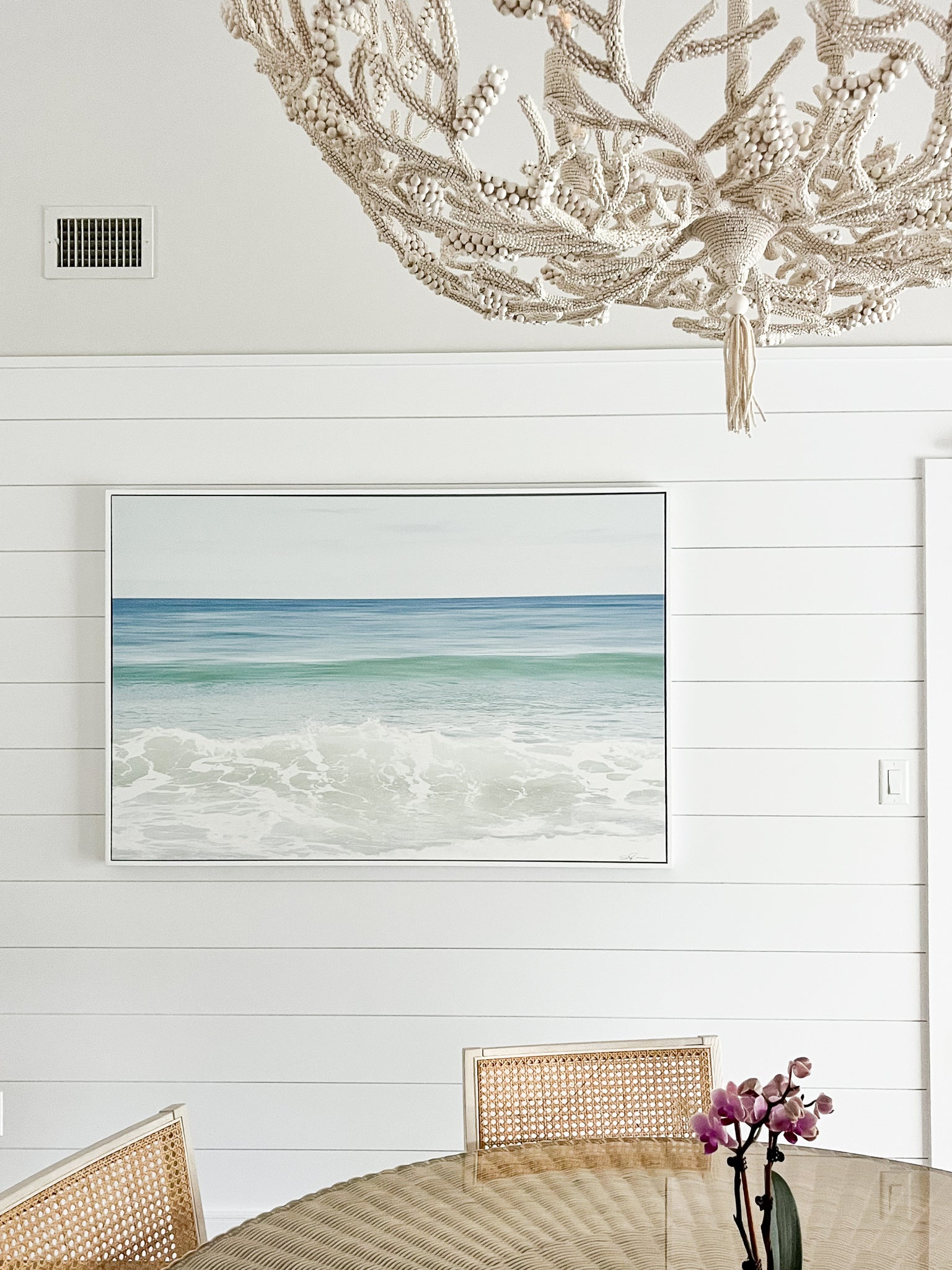 Shades of Blue displayed as a framed canvas in a coastal style dining room