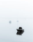 black and white serene nautical image of boats floating on Wychmere harbor, Cape Cod