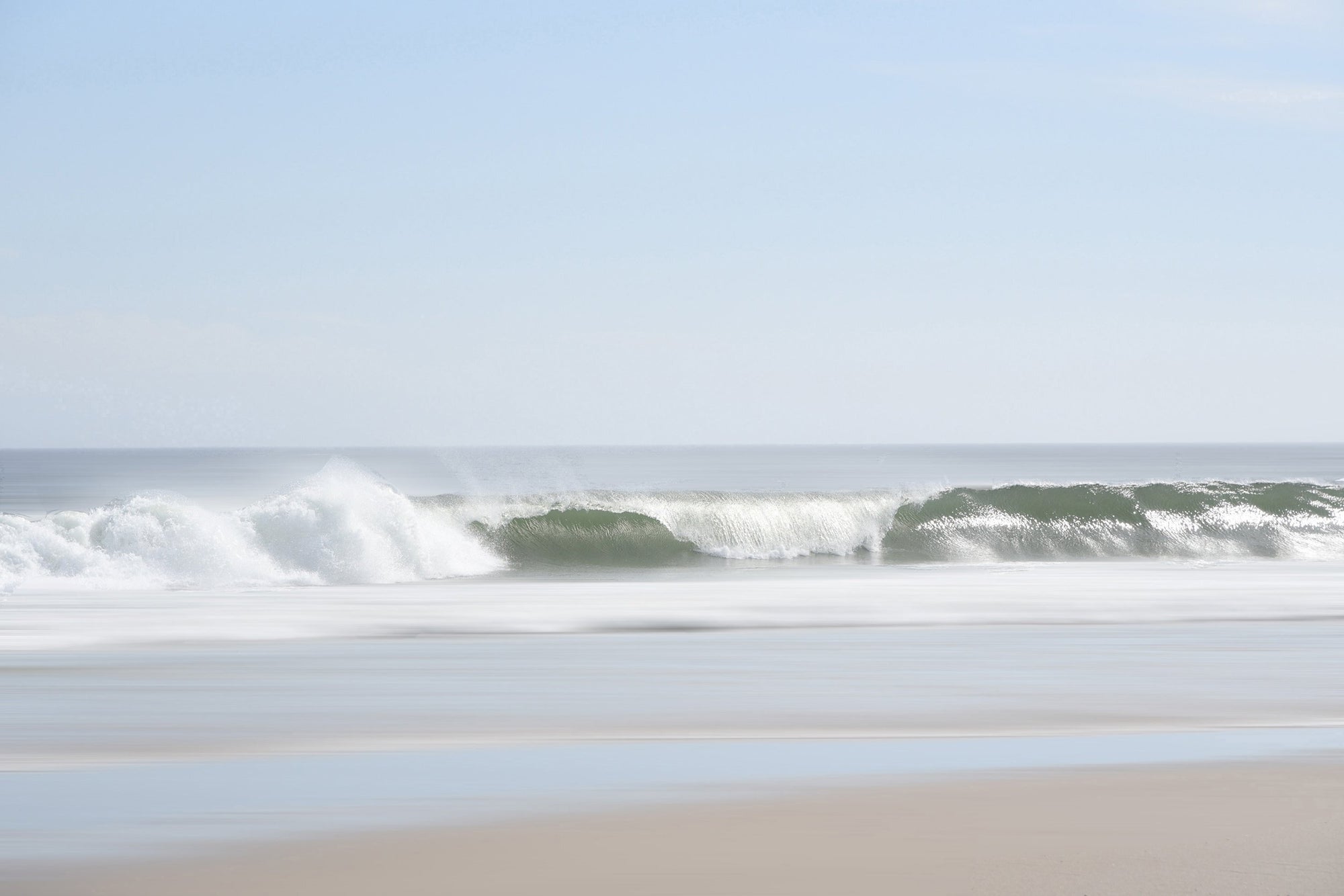 Waves crashing onto sandy beach - coastal wall art